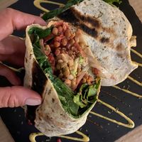 Wrap Optimista con lentejas y extra de queso vegano y cebolla al grill at Sanissimo - Gran Via in Madrid