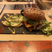 Red Dragon Burger with baked potatoes   at Sanissimo - Gran Via in Madrid