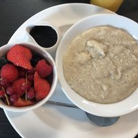 Porridge can be made with water, soya, coconut or almond milk. Lovely fruit and maple syrup on the side.  at Eden Garden Centre in Dundonald