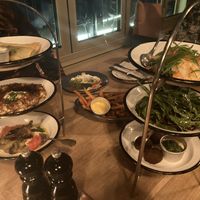 Different kinds of Mezze. Both on the top are not vegan. Vegan Options on the picture: hummus, Burned Aubergine, oven backed sweet potato & Falafel   at NENI in Cologne