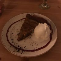 Pear tart with homemade vanilla ice cream and date sauce at MIMO in Malaga