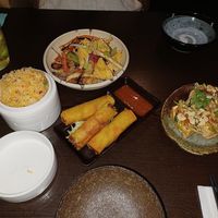 Spring rolls, tofu pockets, fried rainbow rice, and salt and chilli tofu at Suissi Vegan Kitchen  in Glasgow