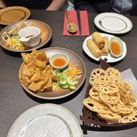 gyoza, wontons, spring rolls, and lotus root crisps  at Suissi Vegan Kitchen  in Glasgow