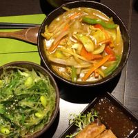 Noodles, vegetable curry, seaweed salad and spring rolls   at Suissi Vegan Kitchen  in Glasgow