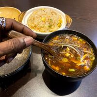 [Yes, I eat with my left hand sometimes, I even know how to use a chopped sticks with both hands, I just love the wood spoon. You taste the food better.] at Suissi Vegan Kitchen  in Glasgow