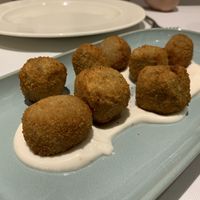 Shiitake and portobello mushroom croquettes on aioli cream .   at Curcuma in Vigo