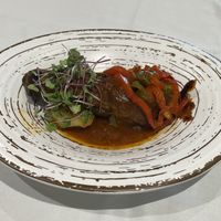 Roast aubergine in a rich sauce  at Curcuma in Vigo