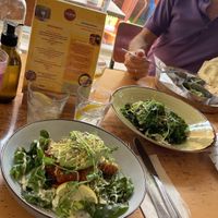 Vegan curry (to the right) and vegetable side dish (in the middle)   at Rooted in Bath