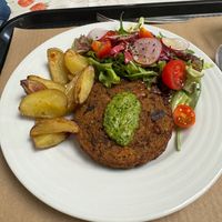 Veggie burger with potatoes and salad. at A Praça in Sintra