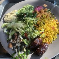 Dates, safran rice w dried grapes, bulgur salad, beetroot hummus, olive hummus, cooked vegetables, broccoli salad ~ at Yalda - Sihlcity in Zurich