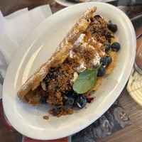 Sweet option with ice cream, whipped cream, blueberries and biscoff crumble   at Älskade Traditioner in Stockholm