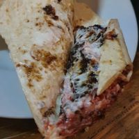 sad little smashed up burger and mayo in a wrap at The Owl & Hitchhiker in North London