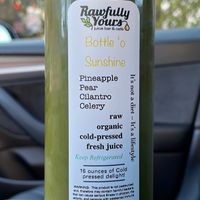 Bottle ‘o sunshine juice from the grab and go refrigerator  at Rawfully Yours Juice Bar & Cafe in Lasalle