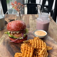 Cheese burger and waffle fries with a berry smoothie   at Lisica Cafe in Maribyrnong