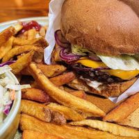 Multi grain veggie burger, crispy fries and house made coleslaw✨ delicious   at Follow Your Heart Market & Cafe in Canoga Park
