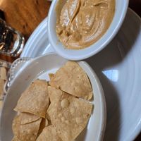 Nacho cheese sauce with chips 😊 at Follow Your Heart Market & Cafe in Canoga Park