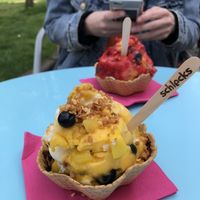 Vegan mango and vanilla ice cream with mango pieces and blueberries at Schlecks in Osnabrueck