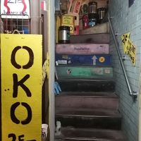 Up this staircase to get your ticket and get in at OKO Okonomiyaki in Osaka