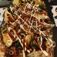 The Okonomiyaki after the mandatory saucing and not mandatory (but recommended) spice adding at OKO Okonomiyaki in Osaka