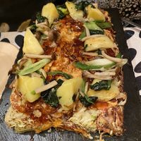 The Okonomiyaki delivered to you. Mine has potato, two types of mushroom, spinach and long onions at OKO Okonomiyaki in Osaka