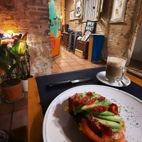 Tostada de palta (aguacate), tomate fresco y seco y queso vegan. at CactusCat Bar in Barcelona