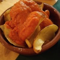 Mi cámara es malísima pero las bravas están de vicio! at CactusCat Bar in Barcelona