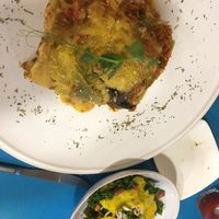 Lasagna that comes with a side salad  at CactusCat Bar in Barcelona