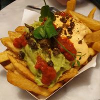 Guacamole fries - gotta ask to be made vegan (take away parmesan and sub the mayo for vegan mayo) at Friet Elite in Maastricht
