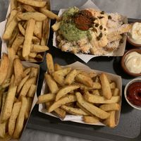 Fries, the one at right bottom is with guacamole (vegetarian because of parmesan cheese on top) at Friet Elite in Maastricht
