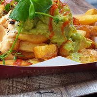 Guacamole fries - if you want this to be made vegan, make sure you ask for vegan mayo and to take out the parmesan at Friet Elite in Maastricht