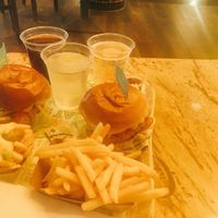 chicken burgers & (loaded) fries at Vedang - green burger | Mall of Berlin in Berlin