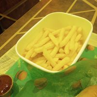 Fries , dip, and a small sliver of the plant based crispy chicken sandwich at Vedang - green burger | Mall of Berlin in Berlin