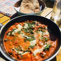 Delicious vegan Shakshuka with spinach and fava beans!  at Beach House in Lyme Regis
