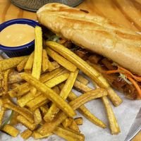 Tofu & avocado bahn mi with plantain friess  at Lalo in Cincinnati
