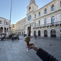 Ice cream in front of the clock towerr  at Ciokkolatte in Padua