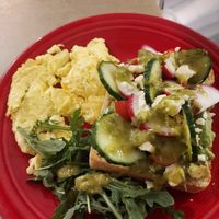 Avocado toast with scrambled egg (optional) House made green goddess dressing is vegan, just ask for no cheese to make it vegan. 😋 at Love Muffin Cafe in Moab