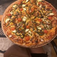 Happy Vegan pizza (change onions for zucchini )  at Jonny Como Pizza in Playa Del Carmen