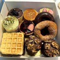 Selection of cheesecakes, waffles, doughnuts and brownies (all vegan and gluten-free) at Healthy Cakes in Valencia