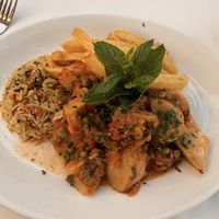 Peas & artichokes with chips & vegetable rice  at Polis Herb Garden in Paphos