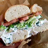 Spinach artichoke tofu spread with broccoli, cucumber, & tomato on an everything bagel.  I love all the veggies. at New York City Bagel & Coffee House in Astoria