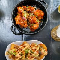 Appetizers cauliflower hot wings and onion rings at Vegan Junkies in Lisbon