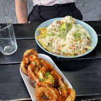 loaded nachos and onion rings  at Vegan Junkies in Lisbon