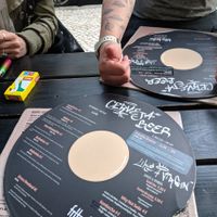 Menus on vinyl records  at Vegan Junkies in Lisbon