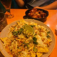 Nachos and cauliflower wings at the back at Vegan Junkies in Lisbon
