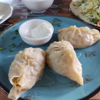 Manti with vegetable filling and non-vegan yoghurt at Registon Restaurant & Cafe in Samarkand