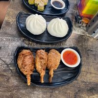 Steamed dim sim, bbq pork bun, and chicken drumsticks  at West End Vegan Restaurant in West End