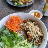 Lemongrass chicken vermicelli salad (foreground) and black bean hokkien noodles (background) at West End Vegan Restaurant in West End