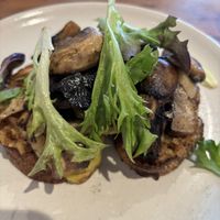 Wild mushrooms on toast. Confit leek and a nutty base with dukkah.   at Little Lotus Cafe in Hobart