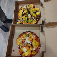 Two small pizzas, the top one matches the size indicated in store at Pizza This Pizza That in Nambucca Heads