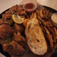 Big Creole Basket With Fried Oyster Mushrooms, Fried Shrimp, Enoki Mushroom, Boudin Ball, Garlic Toast & Fries (soy, Oyster Mushroom) at Vegan Food House in Dallas